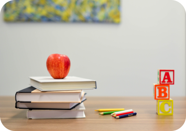 an image of apple on a set of books